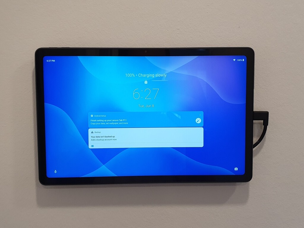 Floating tablet wall mount with charger support