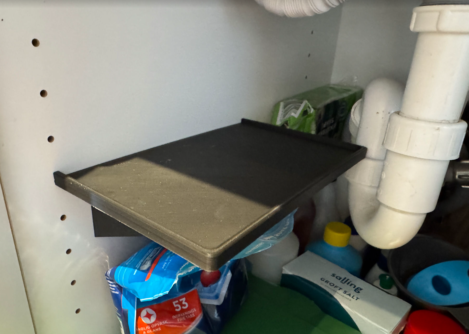 Shelf to place under sink
