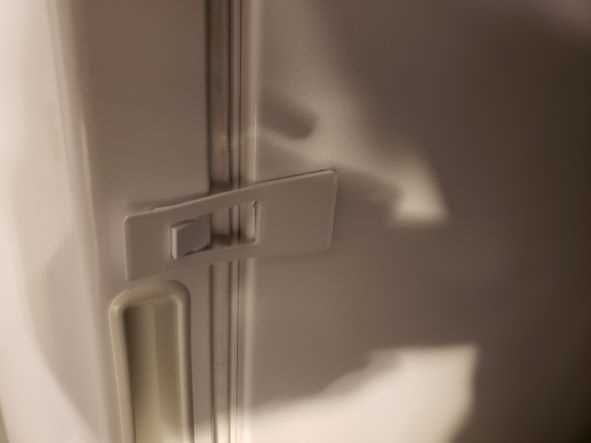 Freezer door safety latch