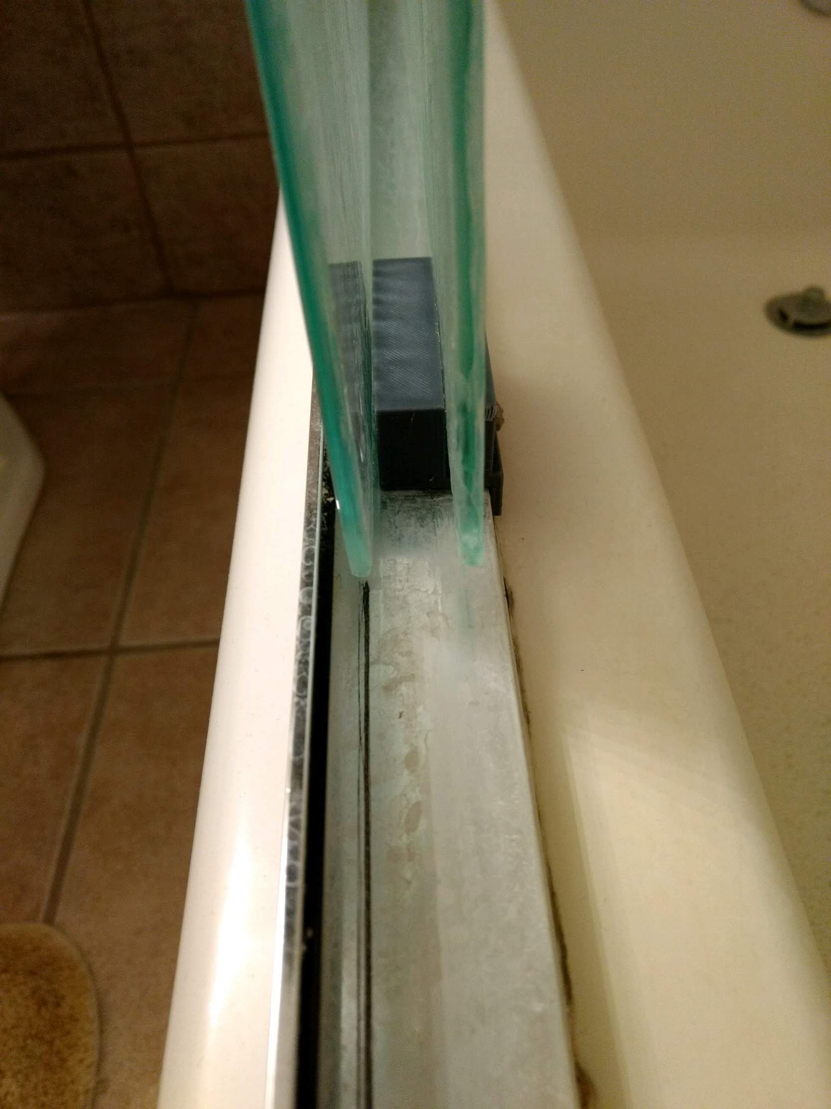 Glass shower door guide