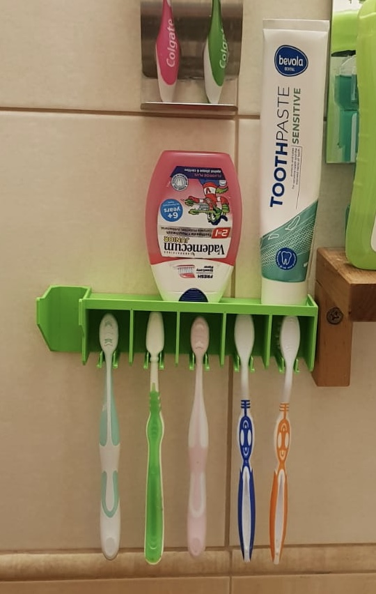 Wall toothbrush holder