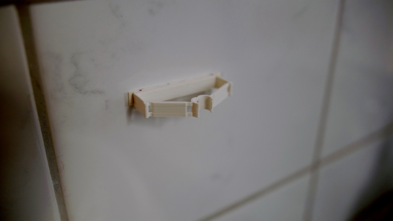 Compliant mechanism toothbrush holder - photo 2