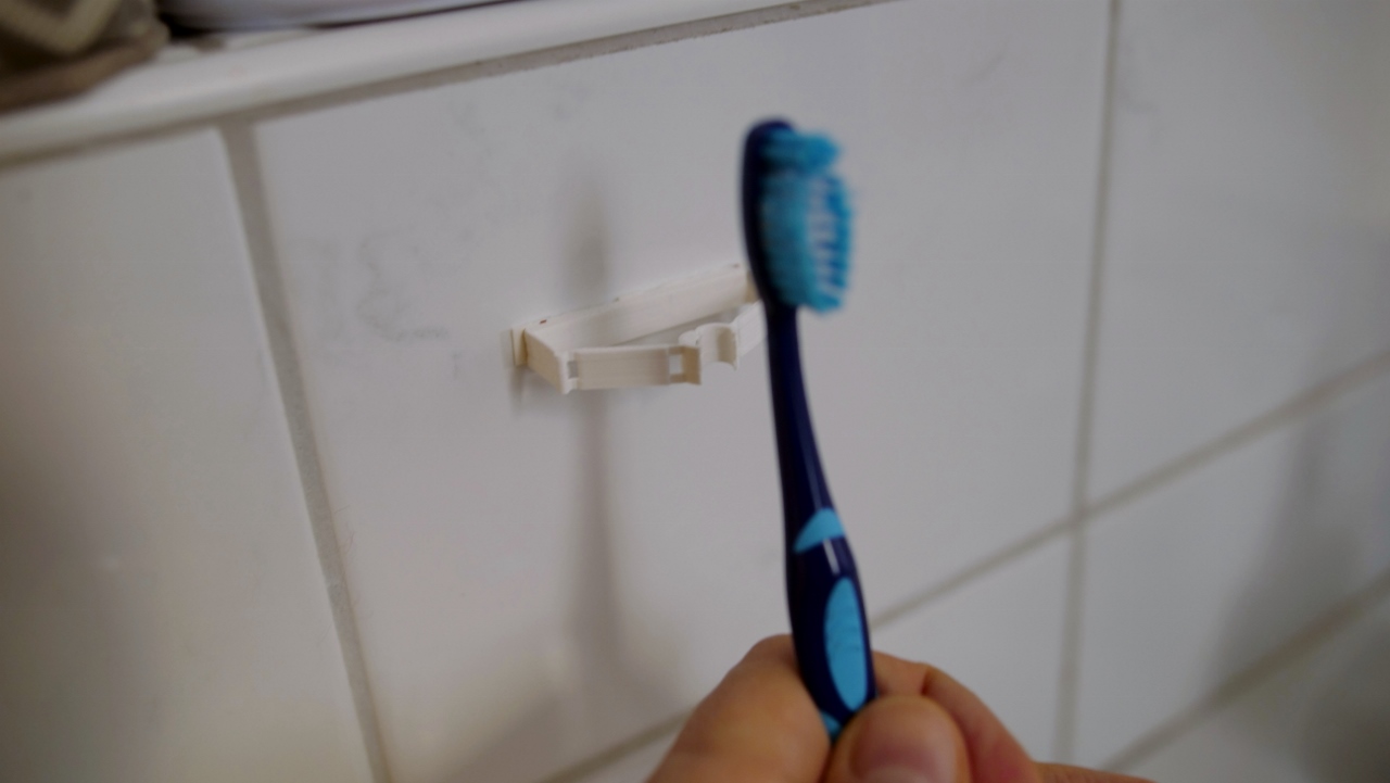 Compliant mechanism toothbrush holder - photo 3