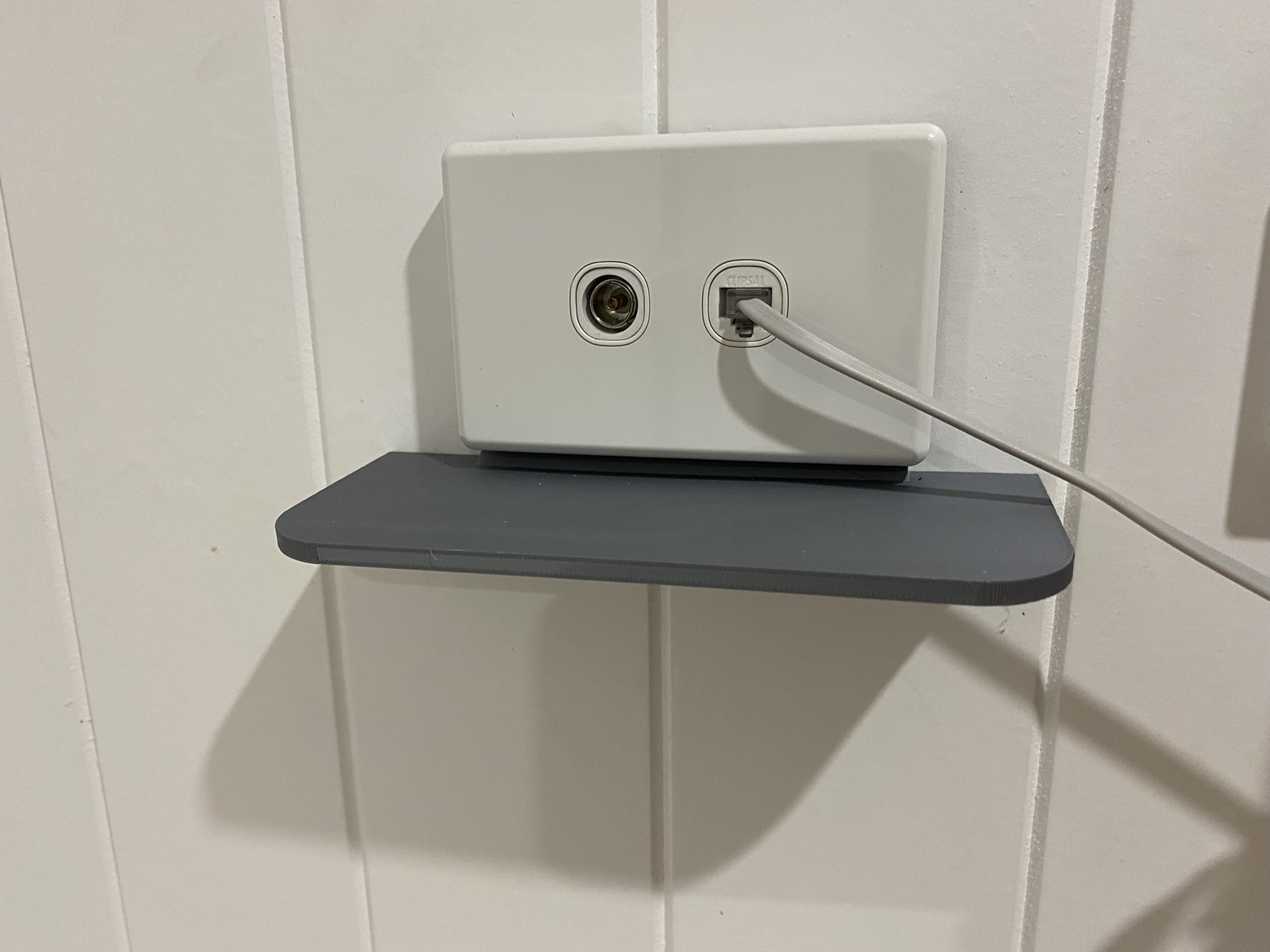 Electrical outlet shelf