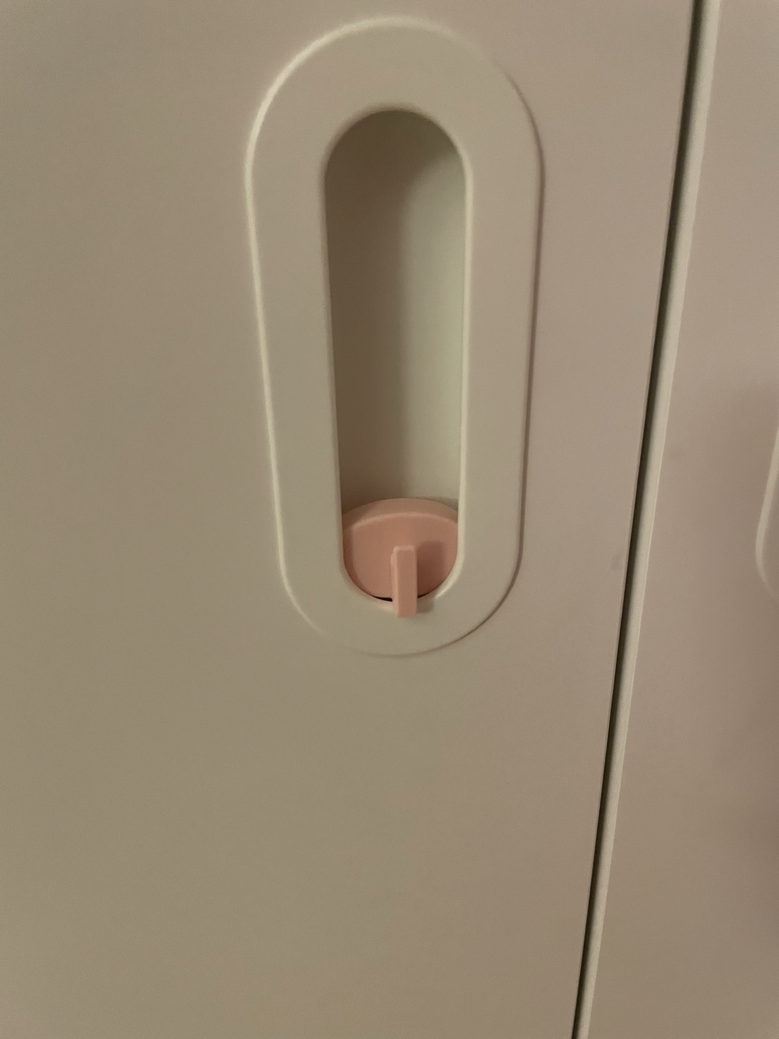 Hook to instert into door handle of an IKEA PLASTA wardrobe.