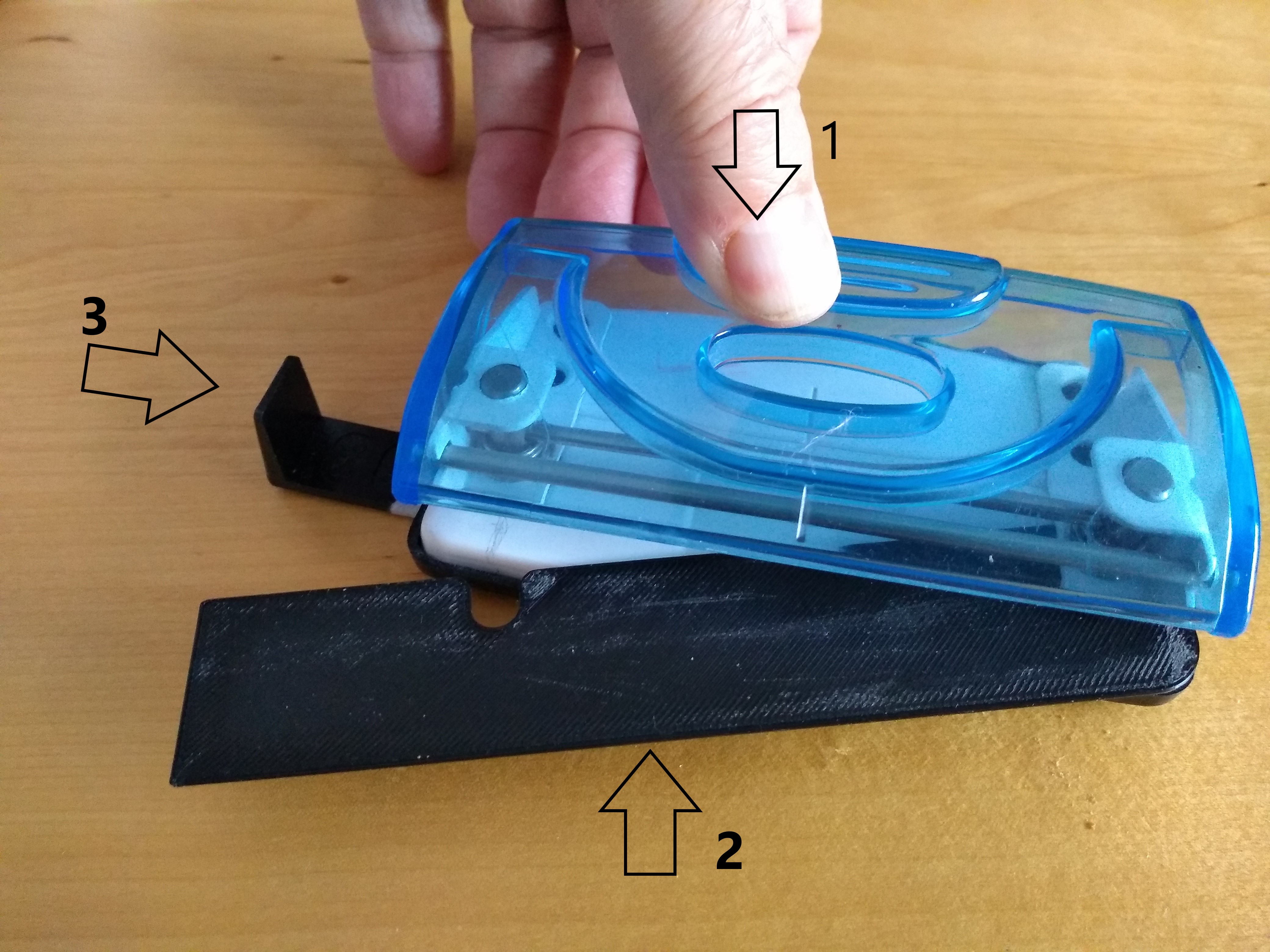 Tool that sets a 2 hole punch to make 4 holes in A4 sheet or plastic face mask screen..