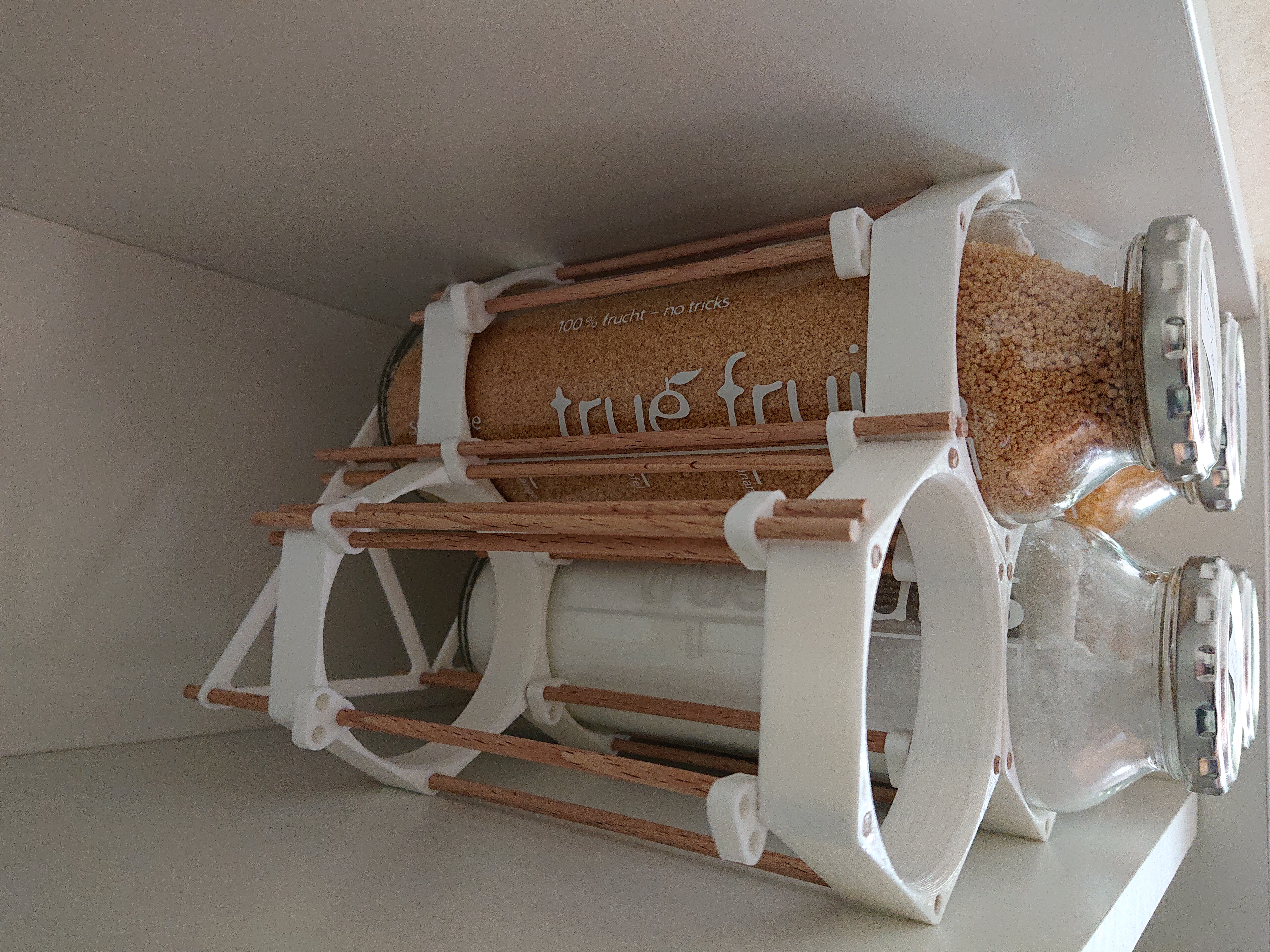 Modular kitchen storage using upcycled glass bottles. - photo 2
