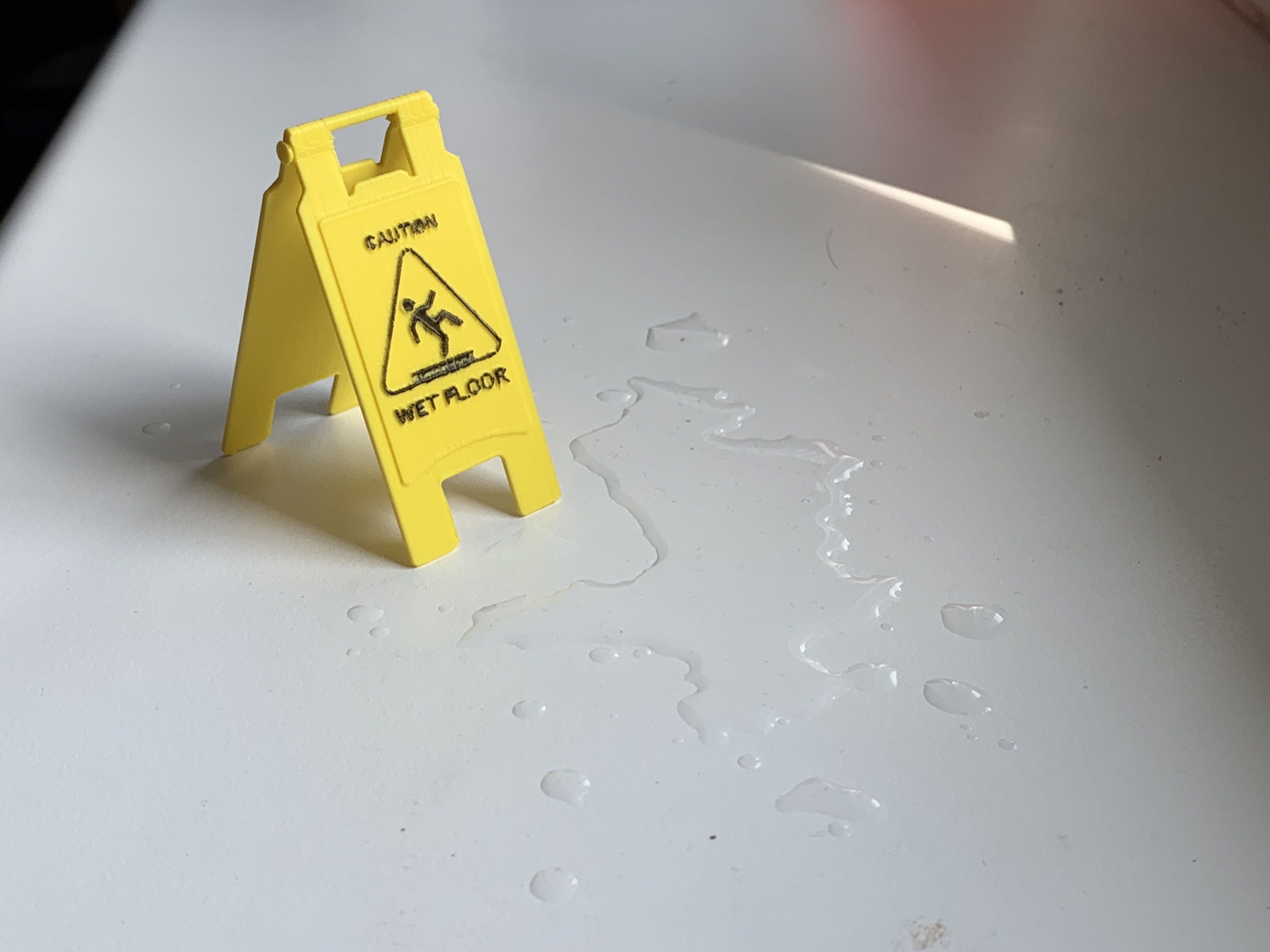 Miniature "Caution Wet Floor" sign
