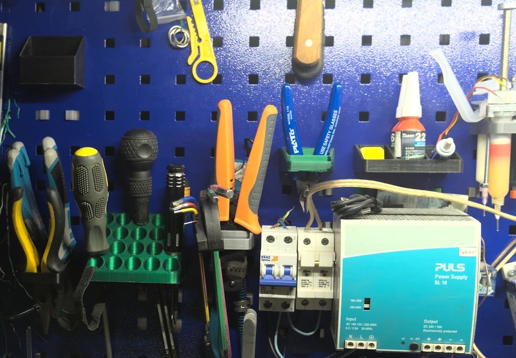 Customizable thing holders for a square peg board