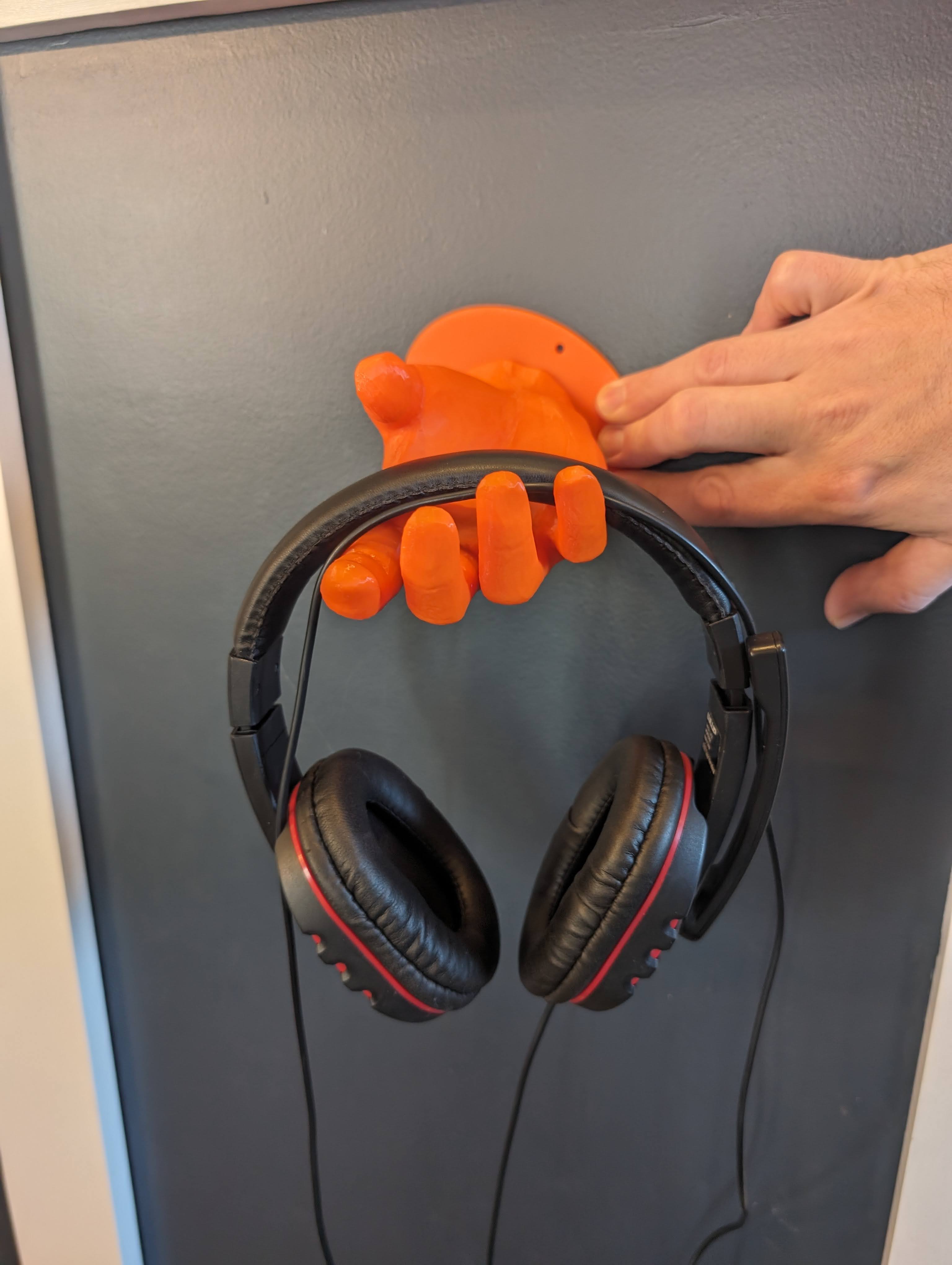 Wall mountable headphone hand stand
