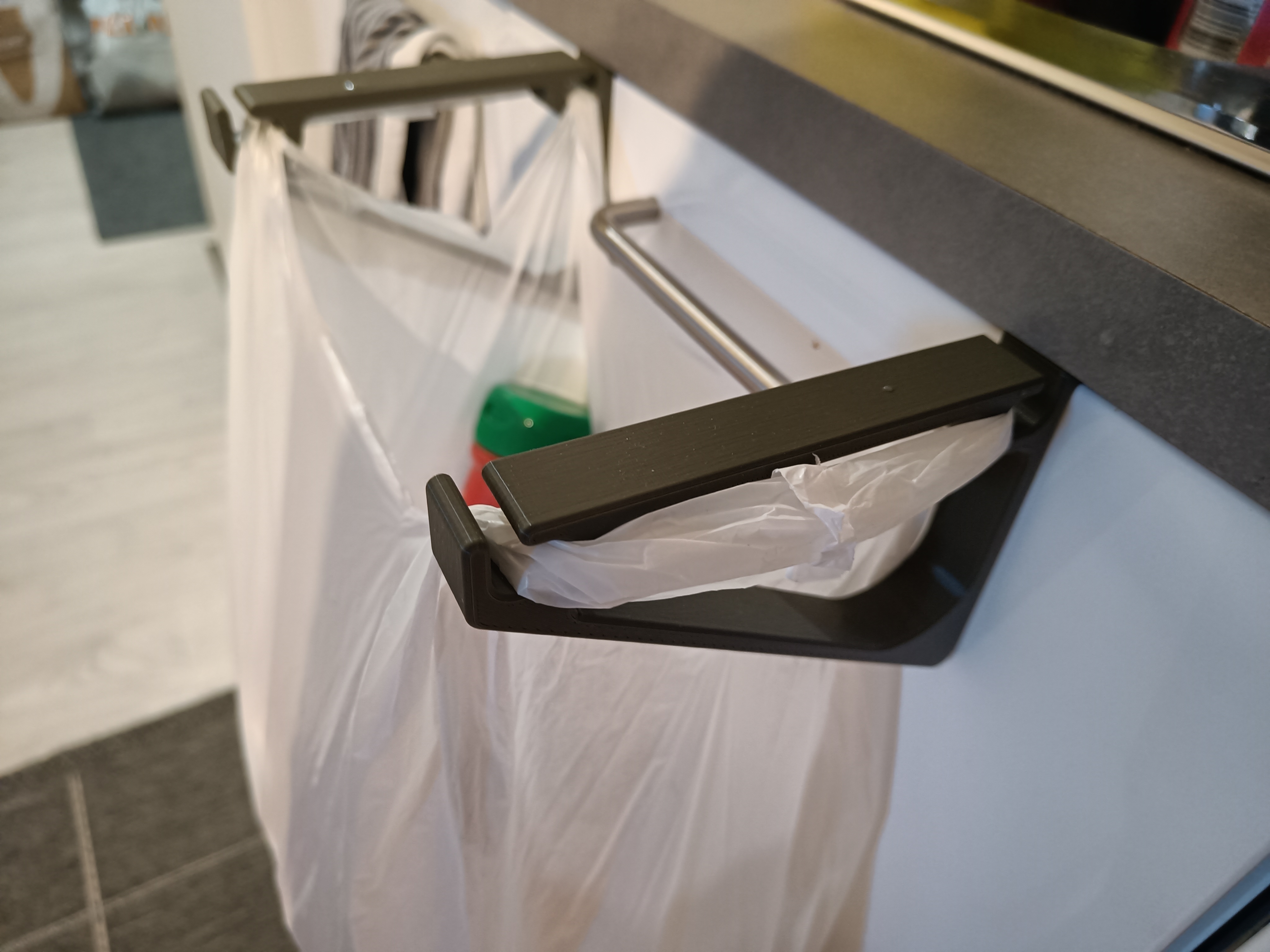 Kitchen drawer bin bag holder